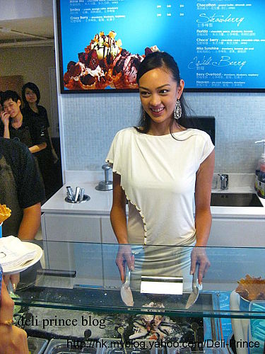 Jessica C. is one of the guests in the Grand Opening. She is pretending to fry gelato